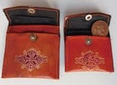 2 vintage tooled leather coin purses embossed with traditional design