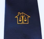 ATRO tie with logo scales inside a house emblem vintage blue British tie