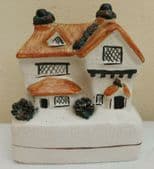 Ceramic cottage money box Staffordshire style pottery thatched house
