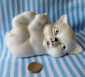 White kitten ornament ceramic cat figurine with its legs in the air